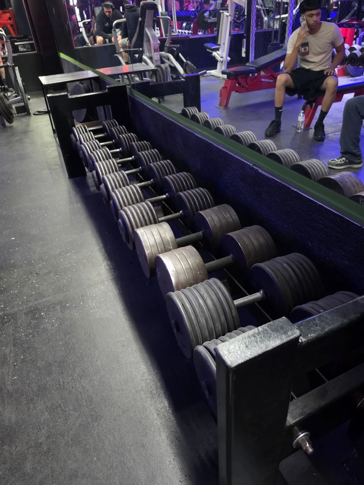 Heavy dumbbell set ranging from 5 to 160 pounds at Iron Arms Gym