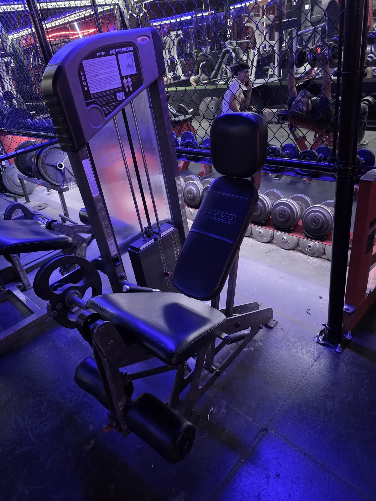 Flex Fitness center-post leg extension machine at Iron Arms Gym