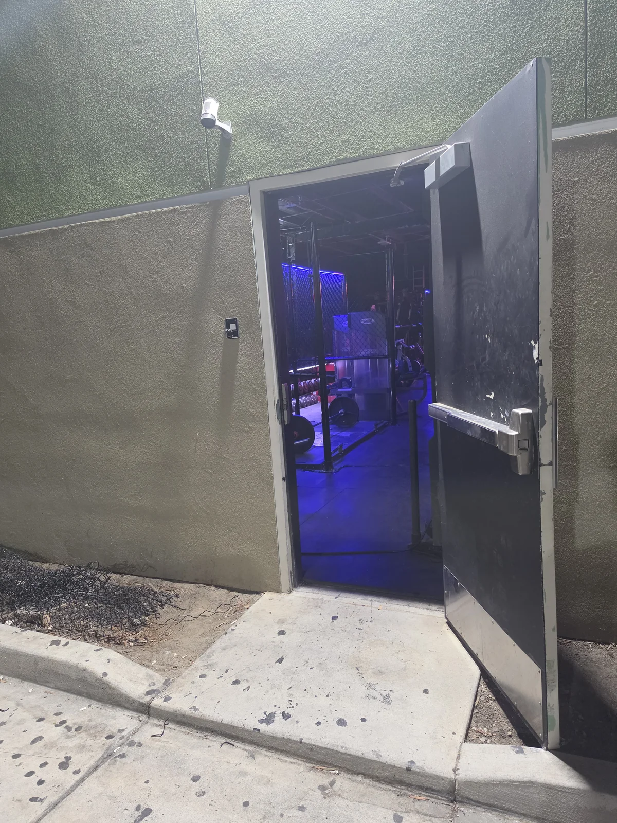 24-hour member entrance open to the training floor at Iron Arms Gym